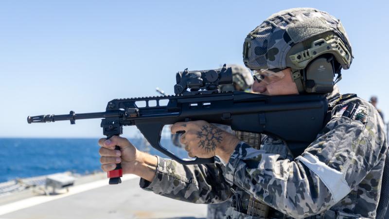 Leading Seaman Combat Systems Operator Michael Little shoots a EF88 Austeyr rifle